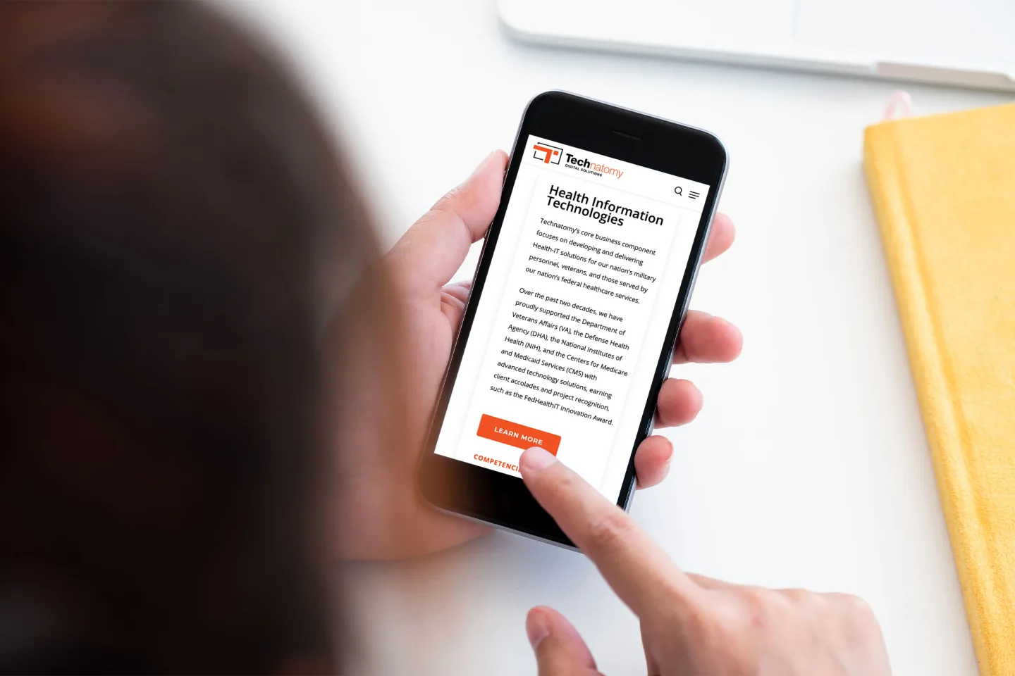 Technatomy Health Information Technologies capability page displayed on a mobile phone